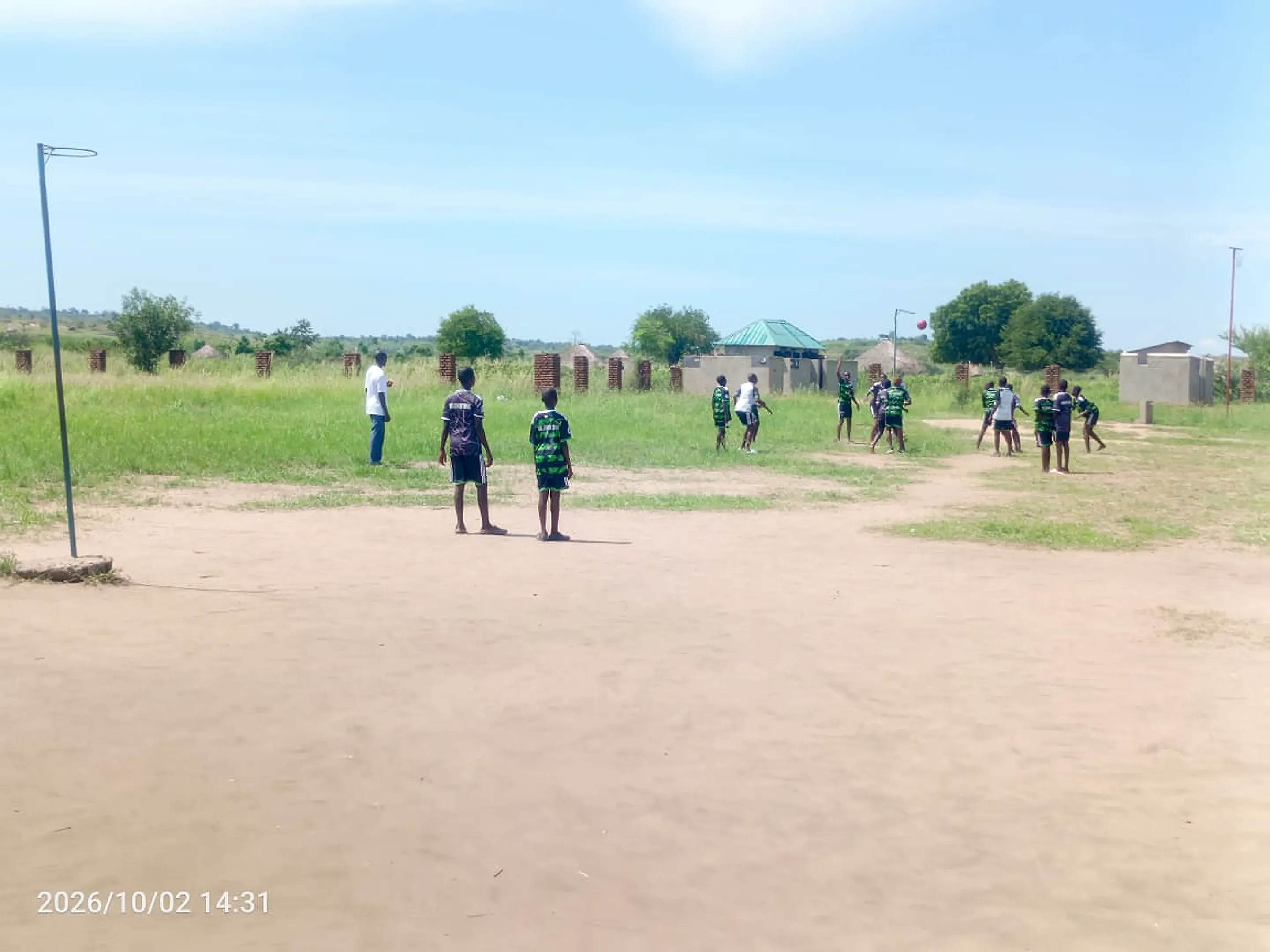 Pupils practising athletics on the school field