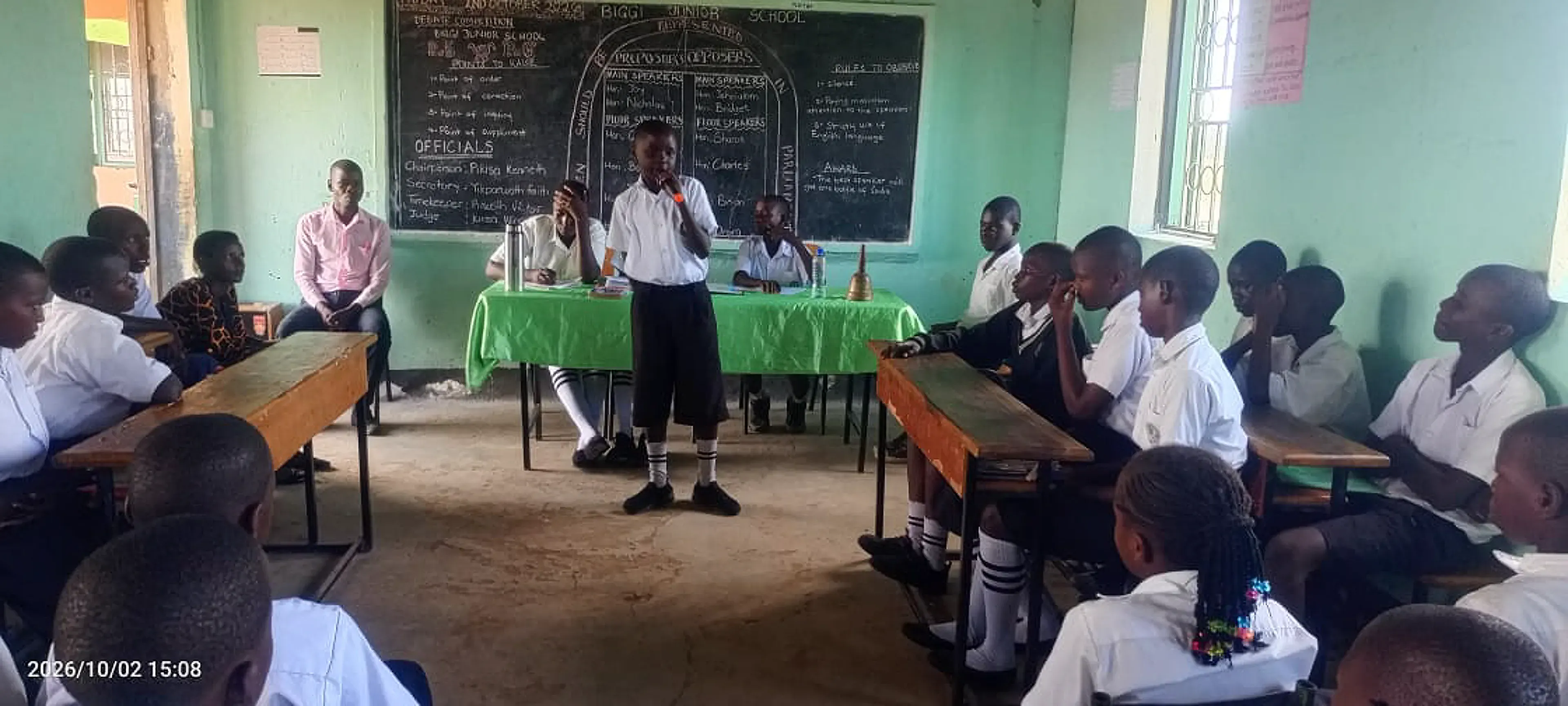 A pupil speaking during a debate club meeting
