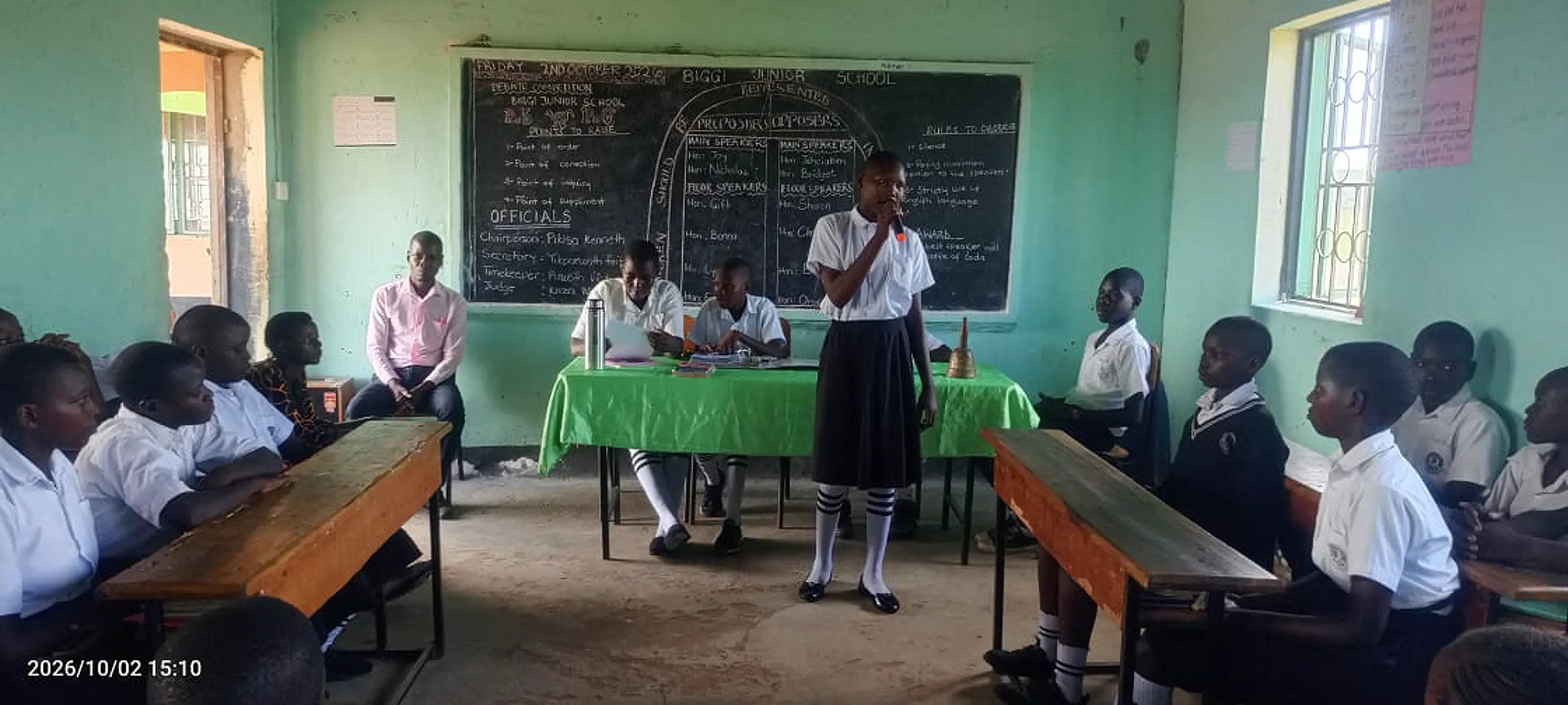 A pupil speaking during a debate club meeting