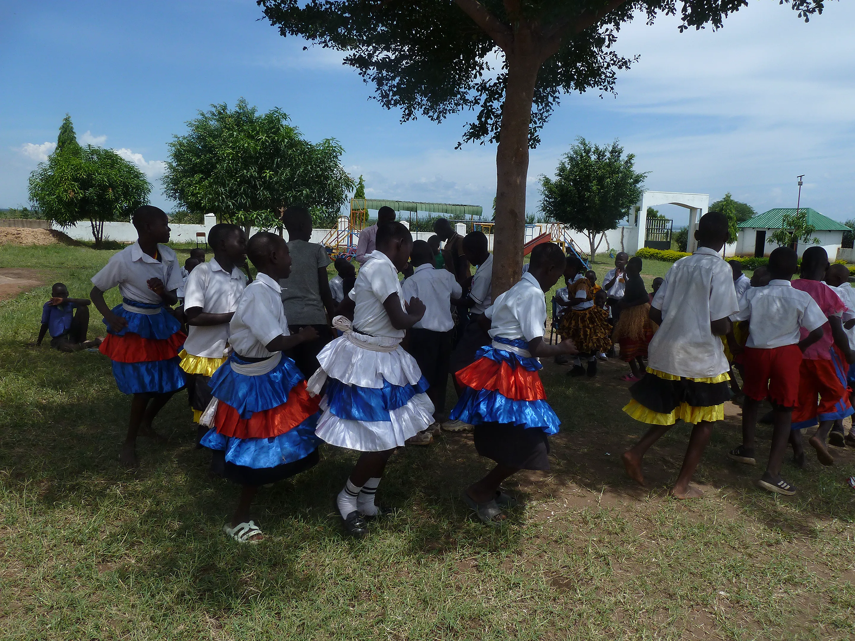 Pupils playing instruments and dancing in music club