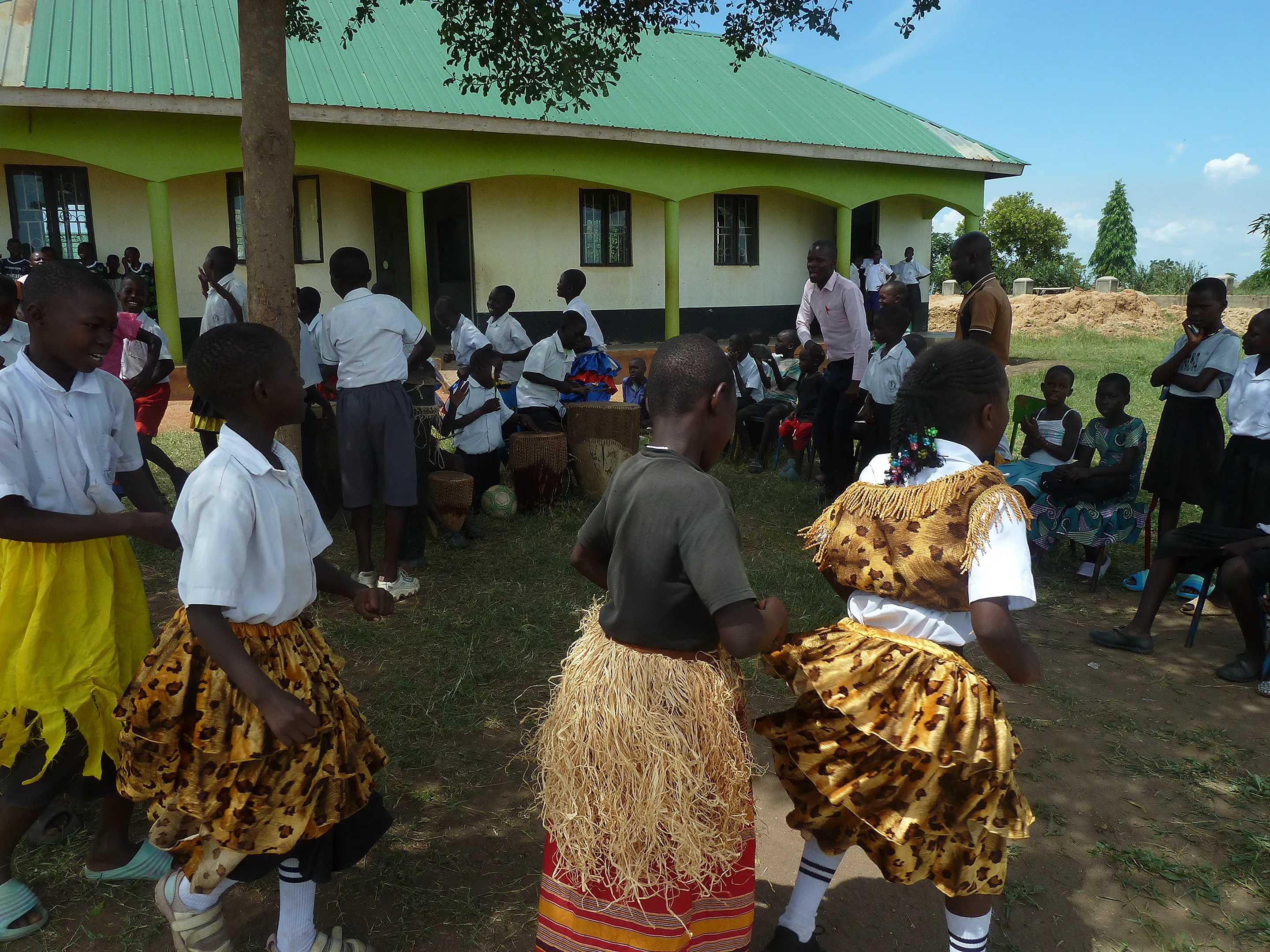 Pupils playing instruments and dancing in music club