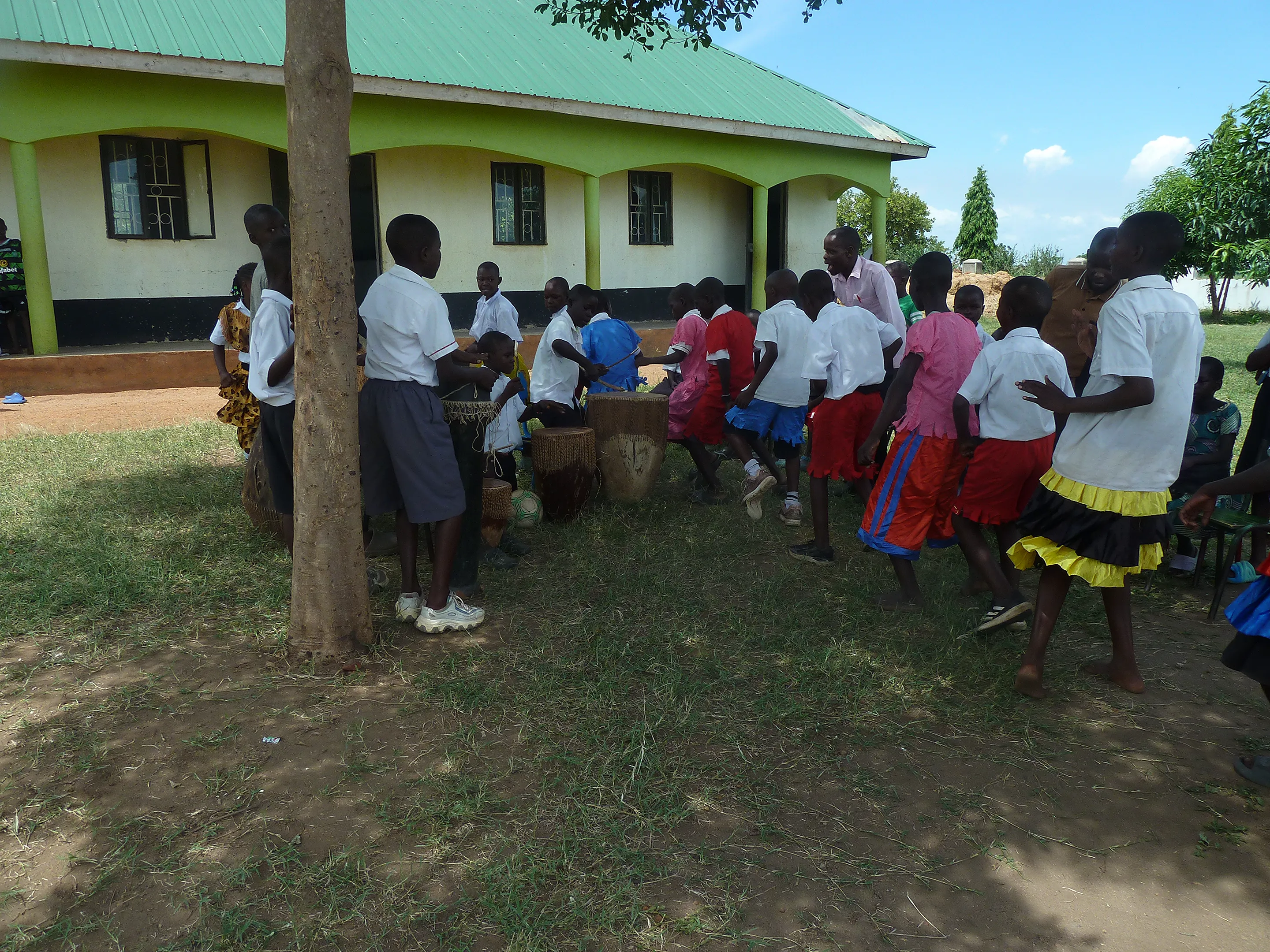 Pupils playing instruments and dancing in music club