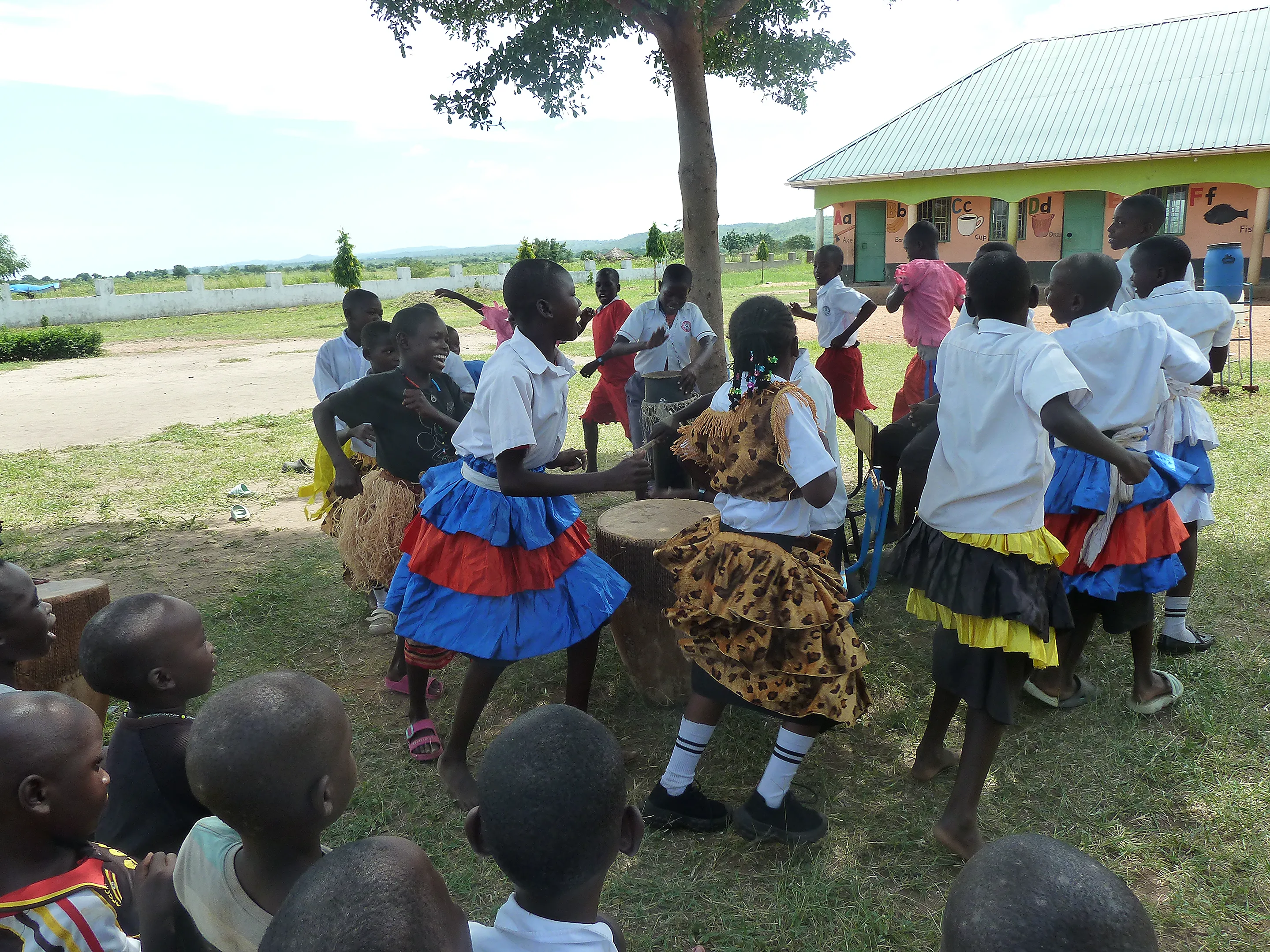 Pupils playing instruments and dancing in music club