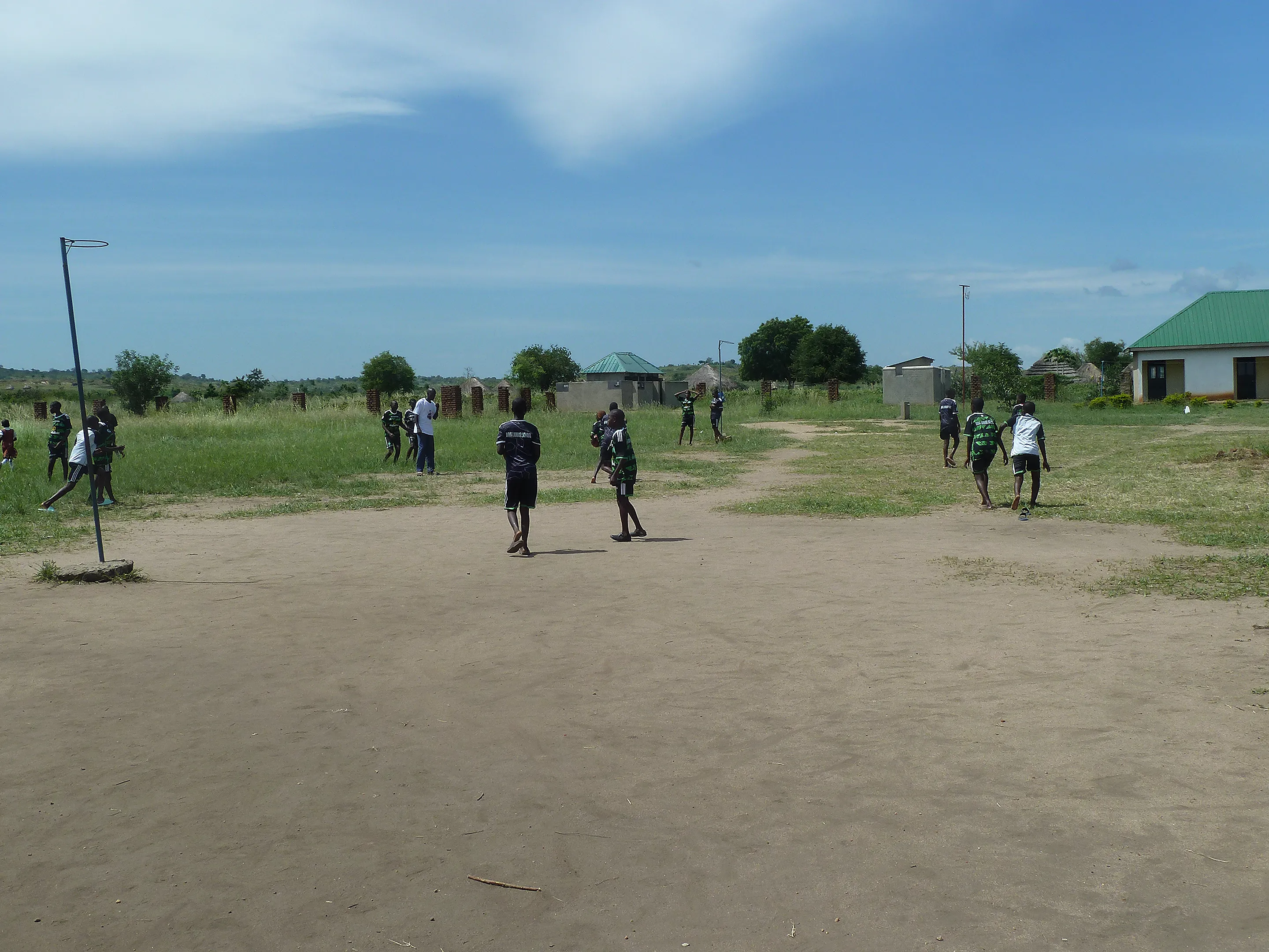 Pupils playing netball on the court