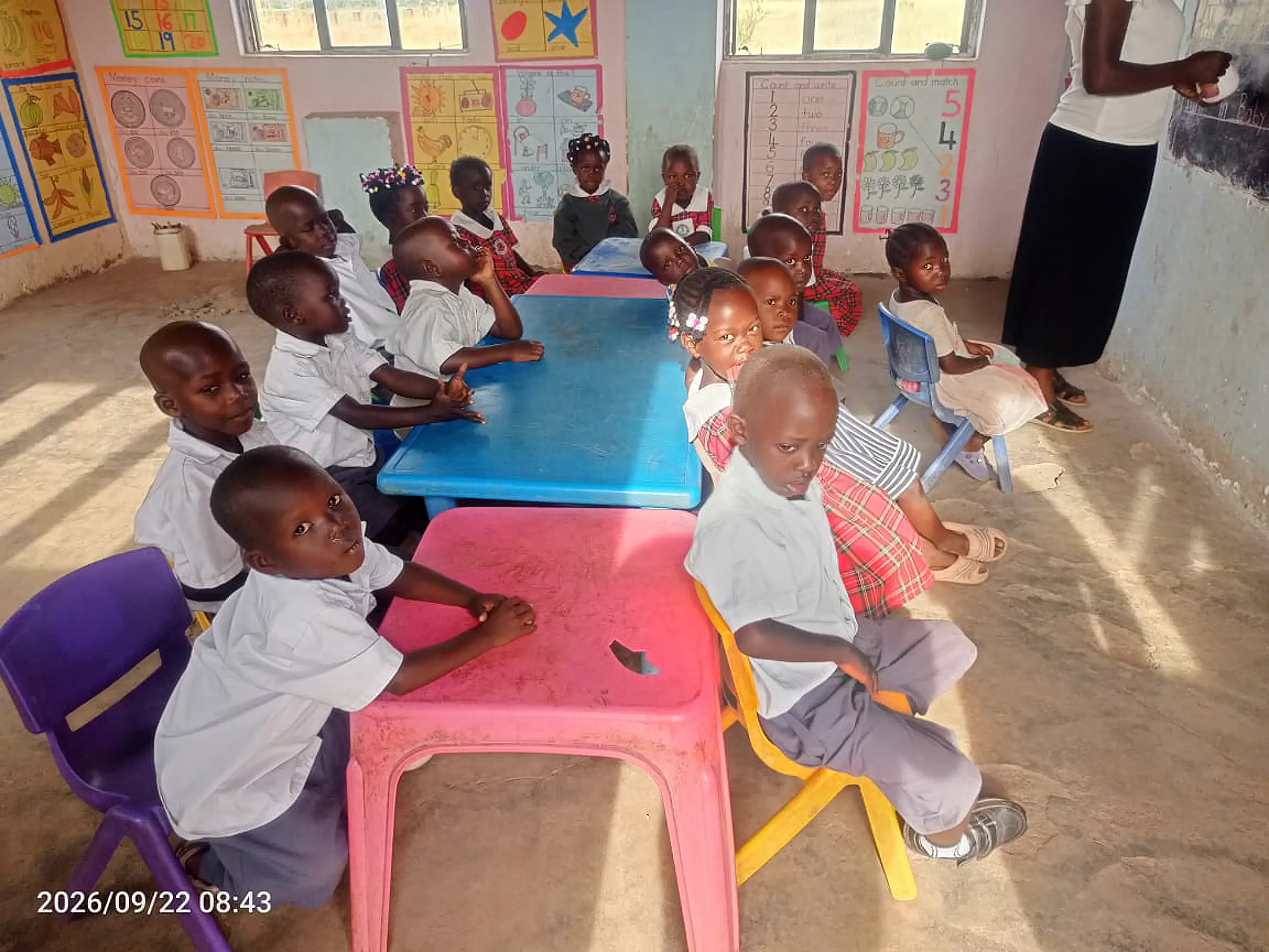 Baby class pupils seated together in their classroom